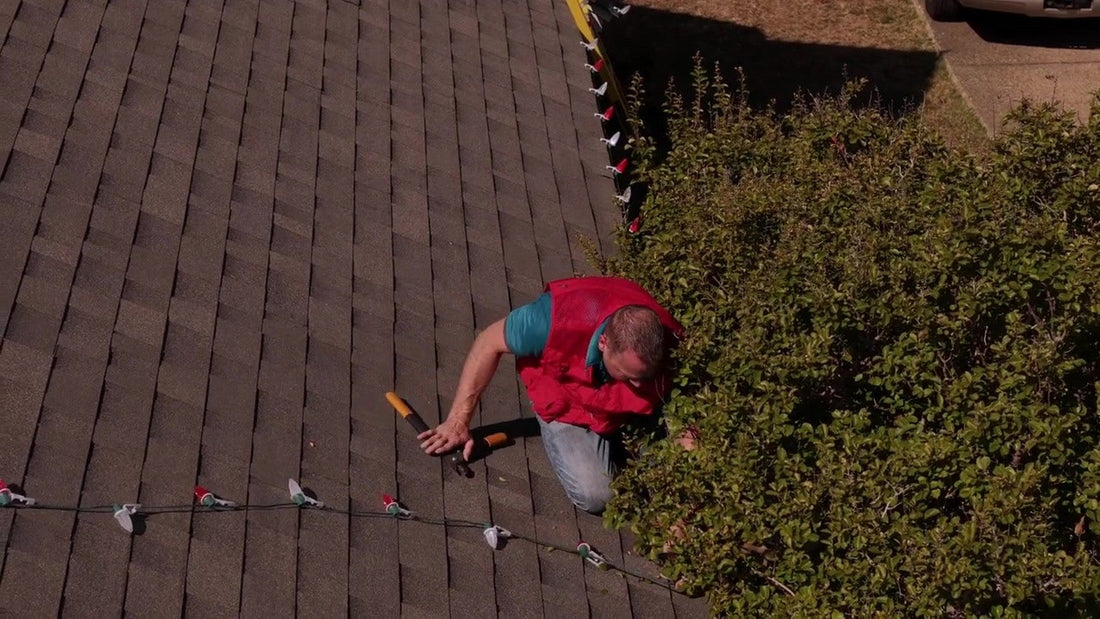Still from "Christmas Lights Installation Video - Lets Get Lit Supply" (YouTube). A finished eave and clean jobsite p...