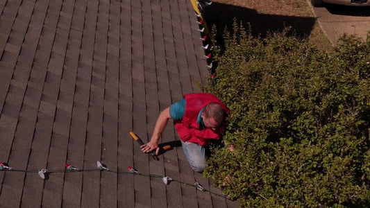 Still from "Christmas Lights Installation Video - Lets Get Lit Supply" (YouTube). A finished eave and clean jobsite p...